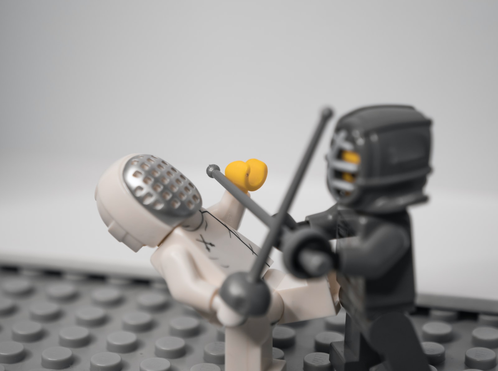 lego minifig holding black camera